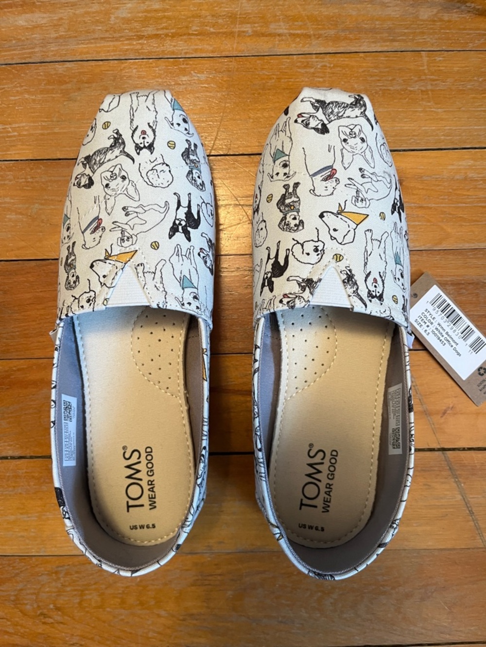 TOMS Women’s White Canvas Slip-Ons with Dog Sketches